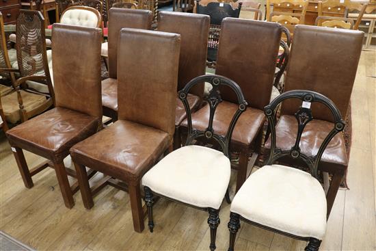 A set of six brown leather upholstered dining chairs